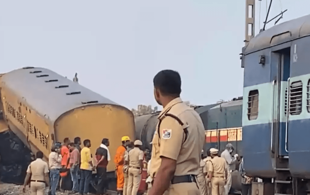 People are standing after two trains crashed in Vizianagaram district in Andhra Pradesh.